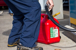 Man filling up gas container