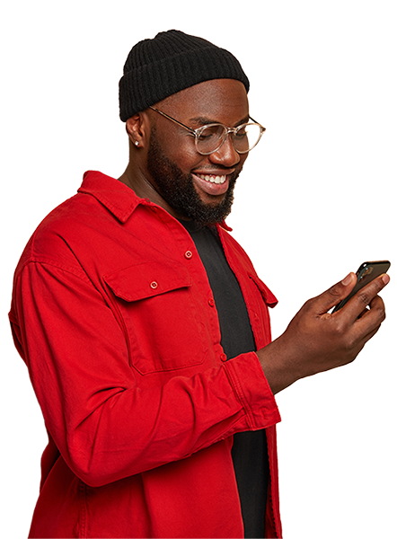 Smiling guy looking at his smartphone