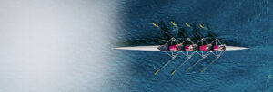 Aerial image looking down on a team of rowers in a scull
