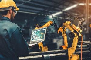 worker setting up a robotic arm