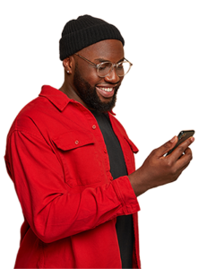 Man in red shirt looking at his mobile phone and smiling