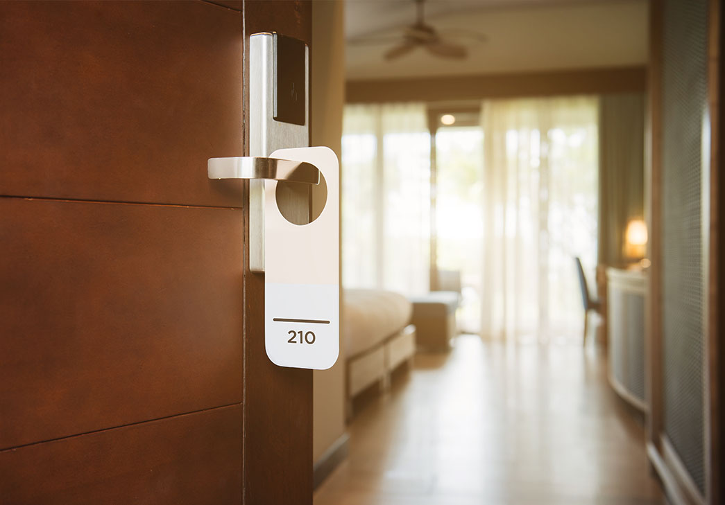 The hotel room with Room Number sign on the door