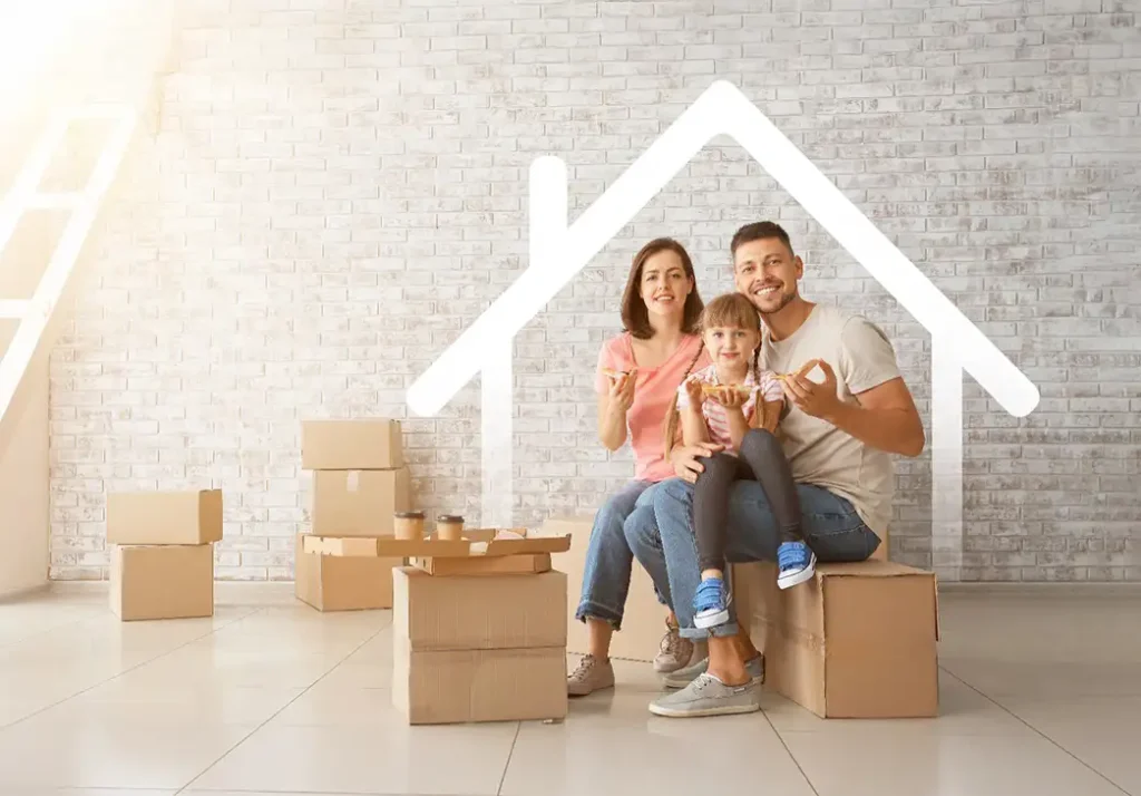 happy family sitting in their new home amid pile of boxes