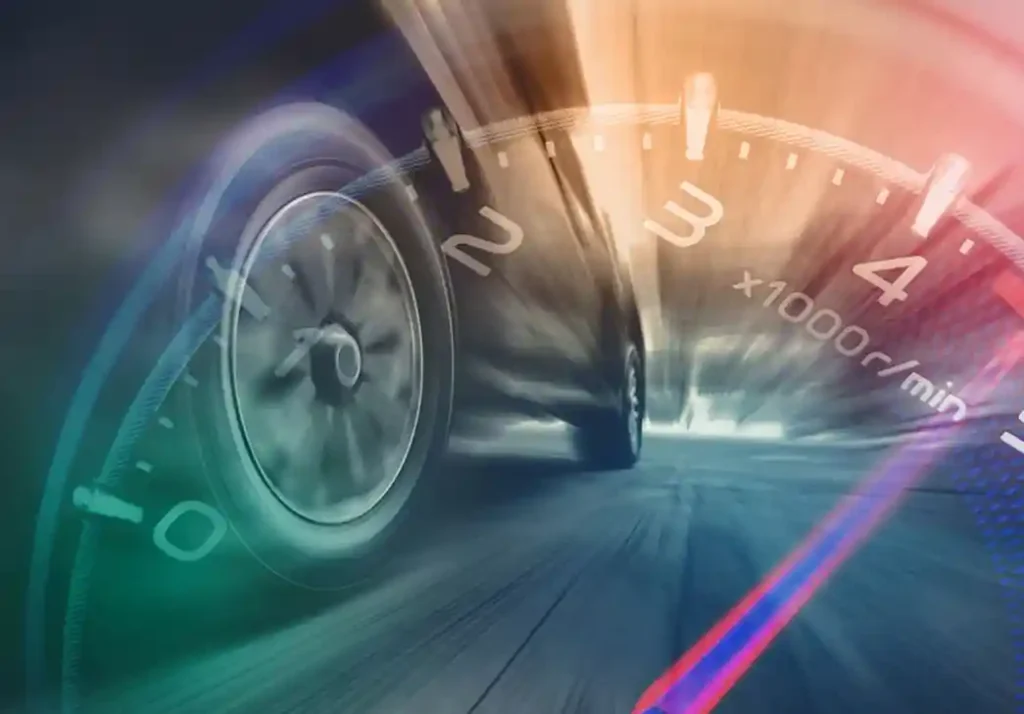 closeup of car with speedometer superimposed over it.