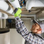 Plumbing Contractor Finishing Sanitary Pipeline Installation